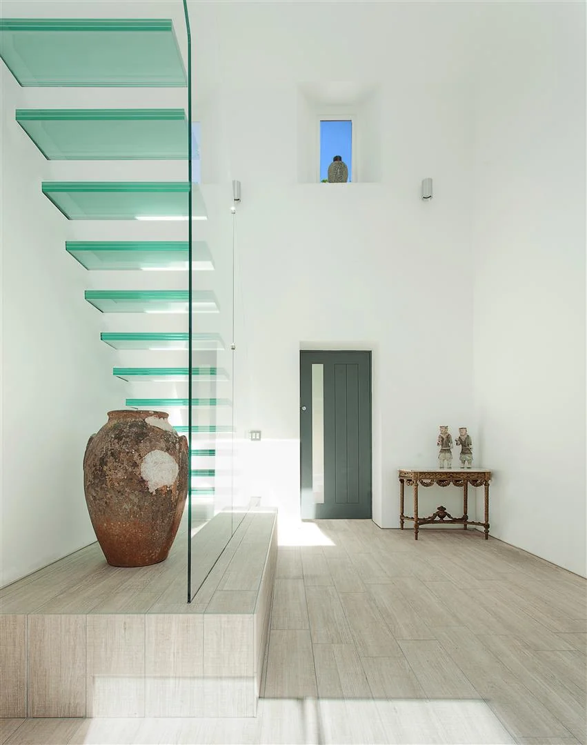 Floating glass staircase at Old Manor House