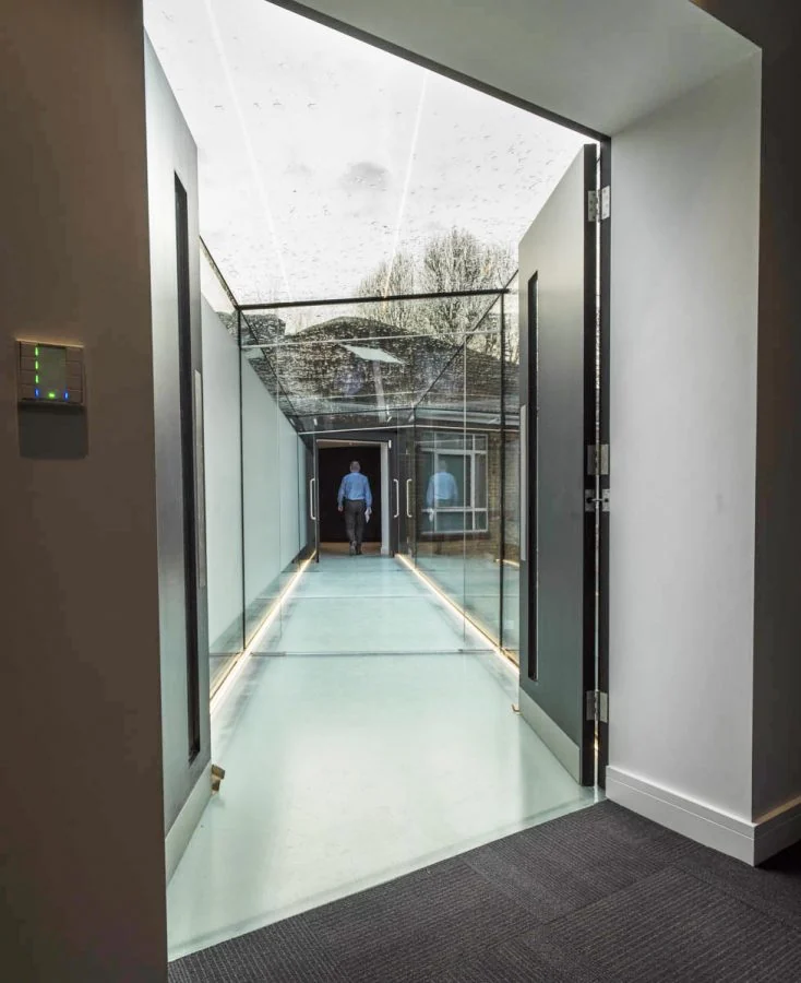 Interior view along the glazed bridge walkway
