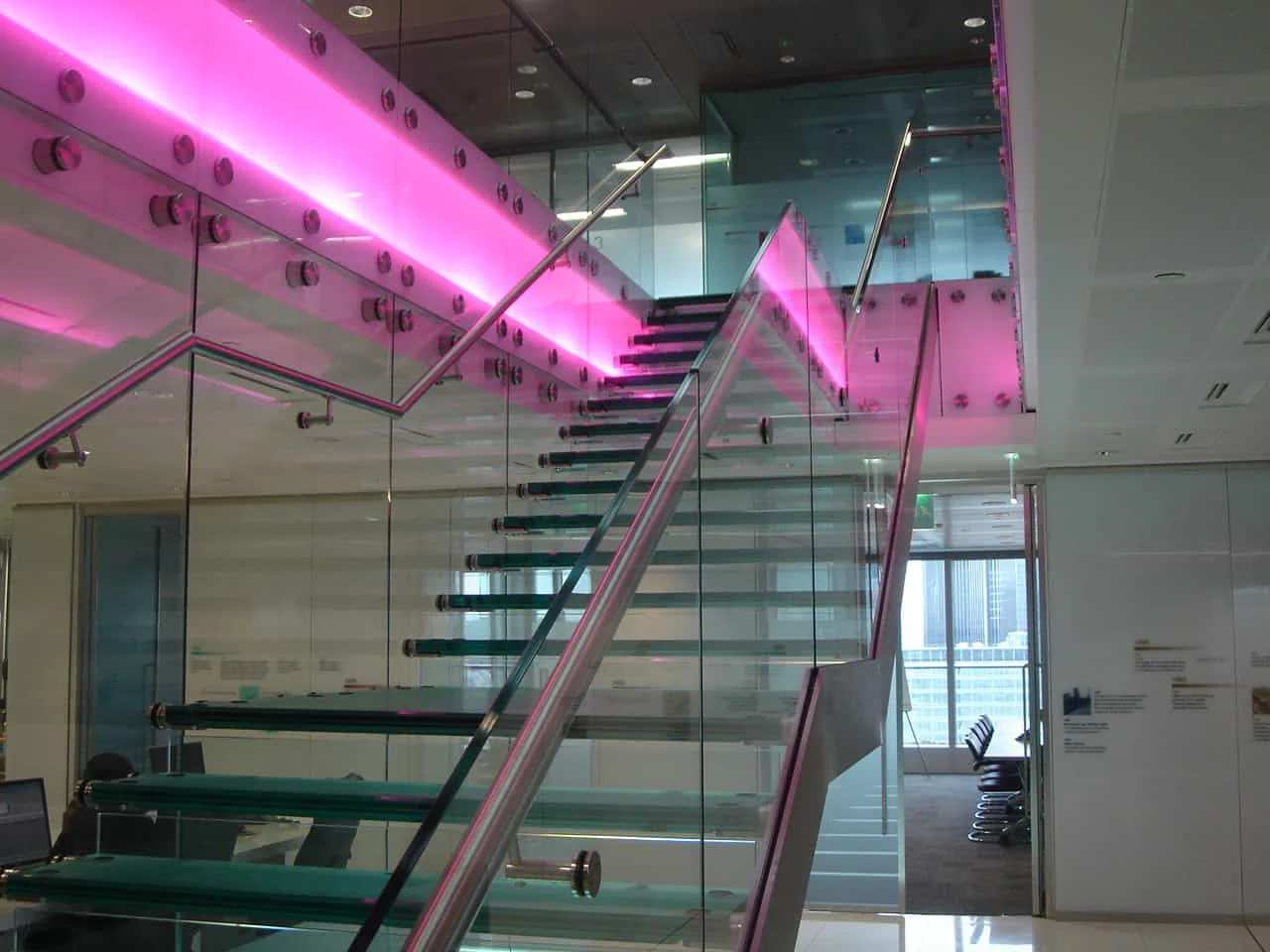 Structural glass staircase with illuminated glass balustrades
