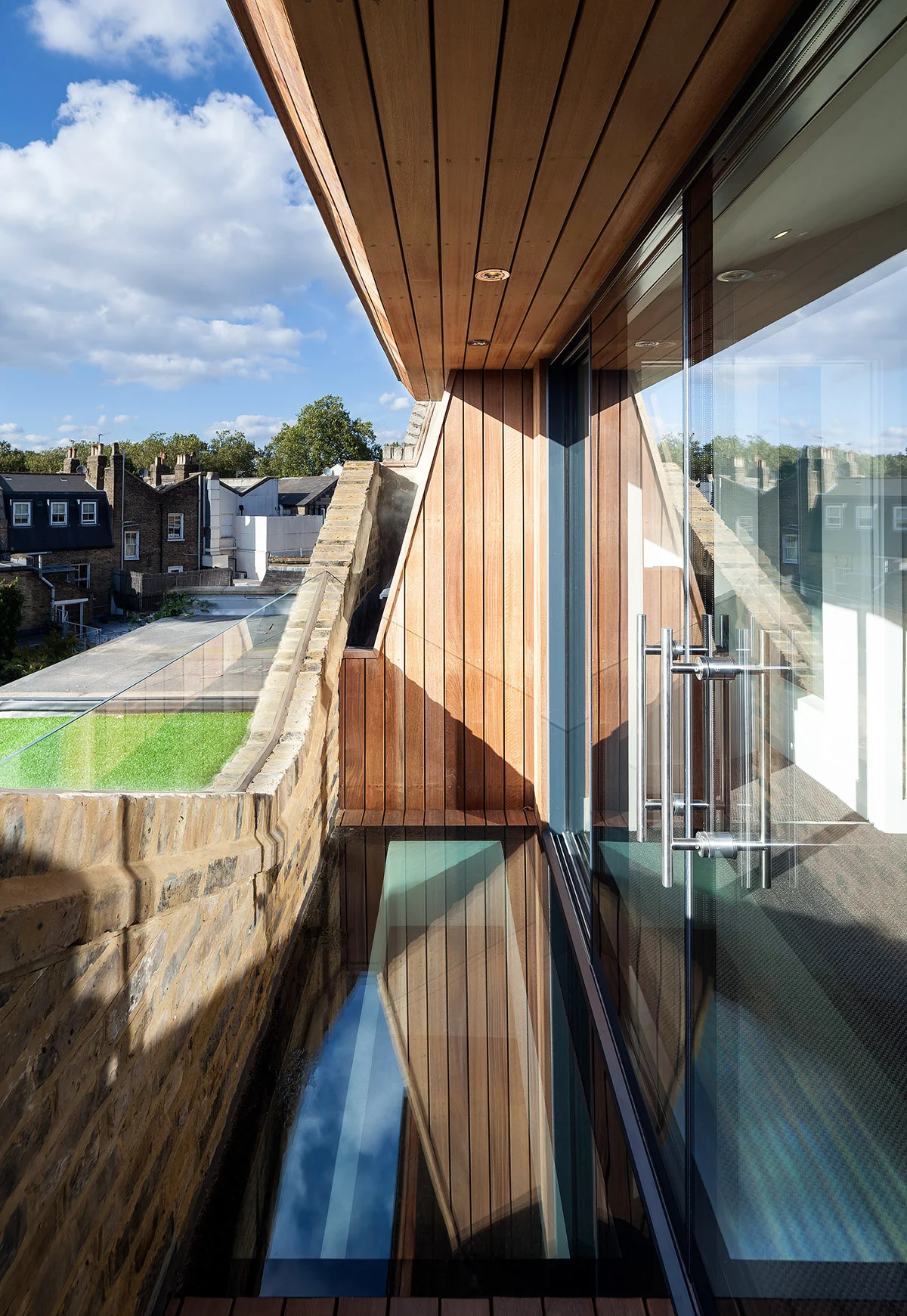St James balcony with glass floor panels beside the glazed doors