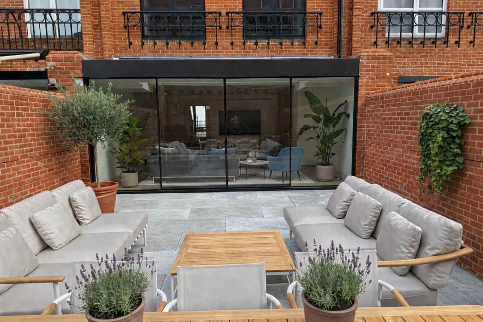 Courtyard seating facing slimline sliding glass doors
