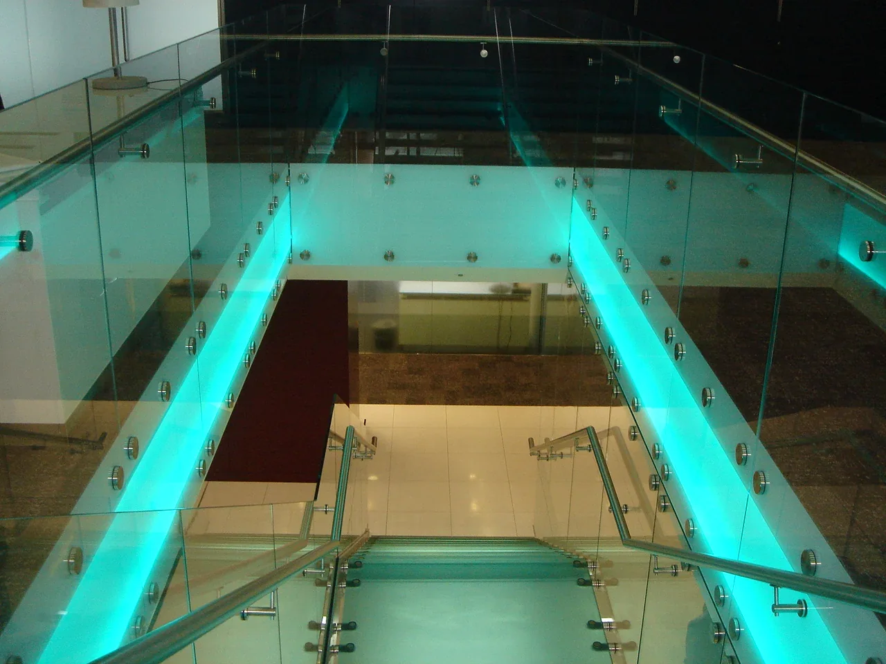 View down the Fortis staircase with illuminated glass