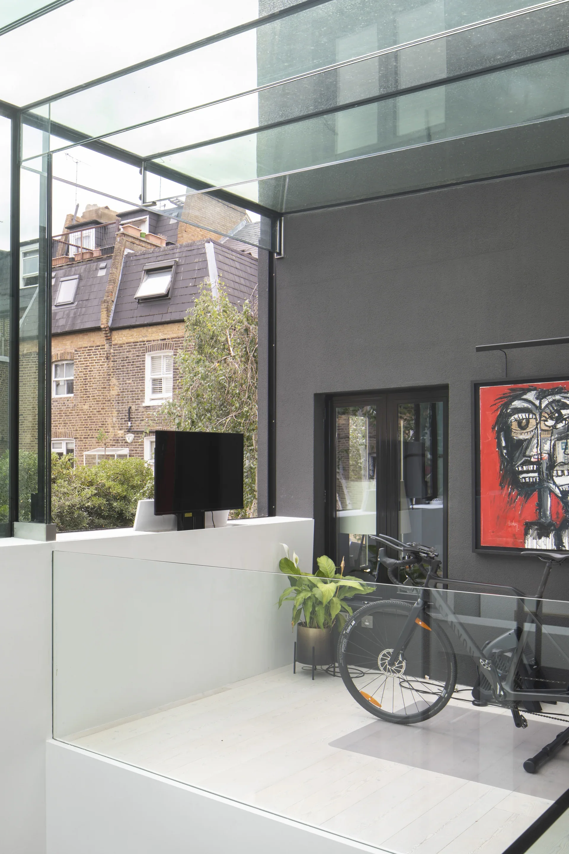 Interior view of structural glazing with a glass roof and glass balustrade